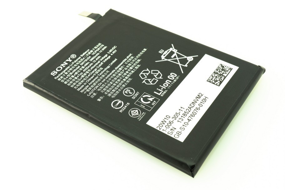 Black lithium-ion battery with white text, featuring a barcode, safety symbols, and product details, designed for Sony devices.
