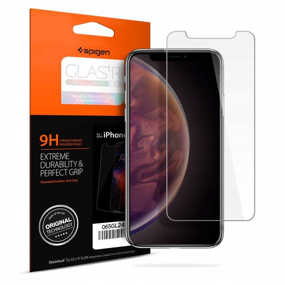 Clear mobile phone screen protector by Spigen, featuring rounded edges, 9H hardness for durability, packaged in an orange and black box with product details.
