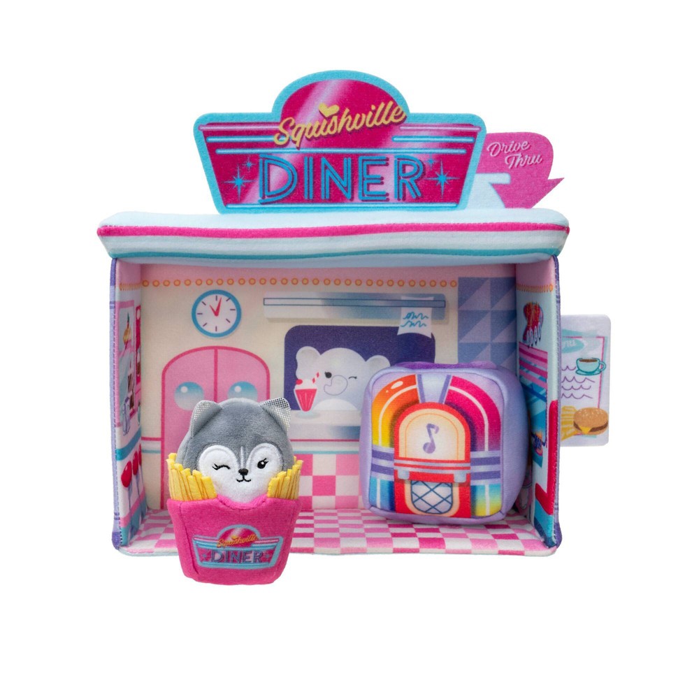 Colorful playset featuring a pink and blue diner with a drive-thru, plush cat in a fries container, jukebox, and various food items, all made from soft, squishy materials.