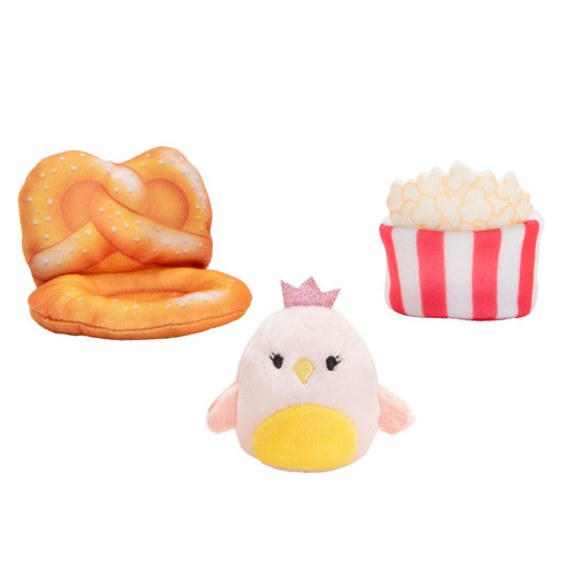 Mini-Squishmallow Play Scene features a soft, plush pink bird with a crown, a yellow and orange pretzel, and a striped popcorn container in red and white.