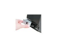 A hand holds a silver USB interface spare part for a Star Micronics printer/scanner, showcasing its metallic finish and connection port.