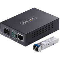 Black StarTech.com media converter with Ethernet and fiber ports, includes small silver transceiver module.