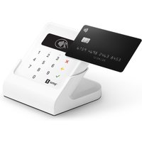 White SumUp Air card reader with cradle, numeric keypad, and contactless payment symbol, holding a black credit card.