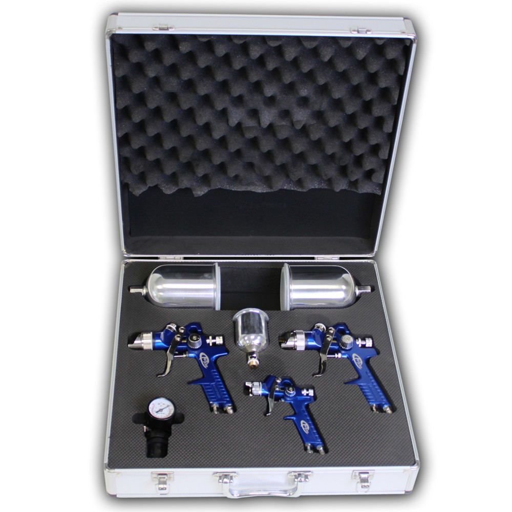 Three blue HVLP paint spray guns (0.8, 1.3, 1.7 mm) with a pressure gauge and two paint cups, all neatly arranged in a protective silver case with foam padding.