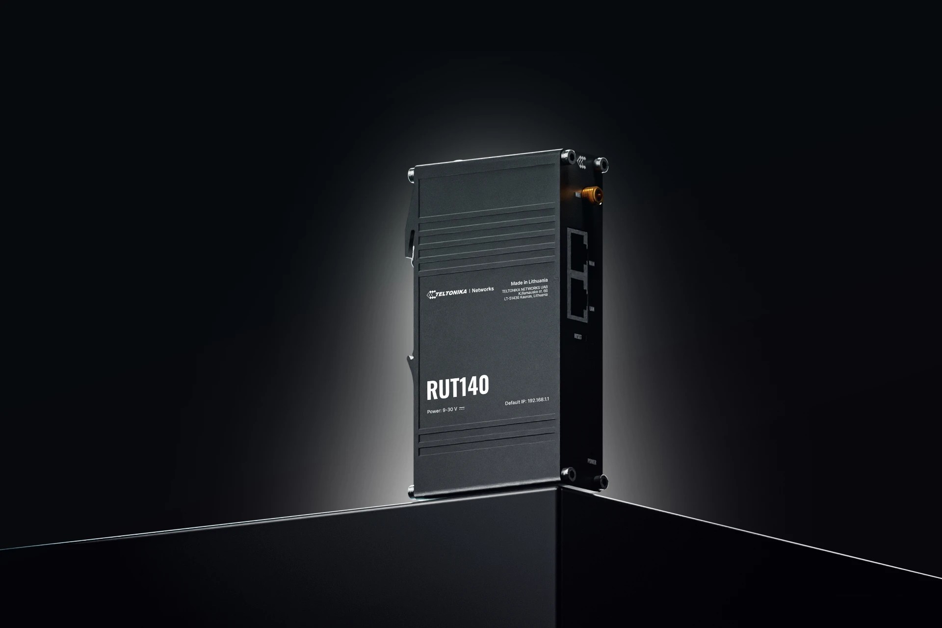 Black metal router with a sleek design, featuring the model number "RUT140" prominently displayed, multiple Ethernet ports, and a compact, modern aesthetic.