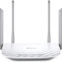 White TP-Link Archer C50 wireless router with four antennas and textured surface.