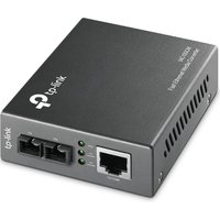 Black TP-Link MC100CM media converter with Ethernet port, fiber connectors, and LED indicators on the front panel.