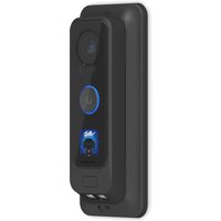 Black Ubiquiti doorbell with camera, circular button, and blue LED ring, mounted on a rectangular backing.