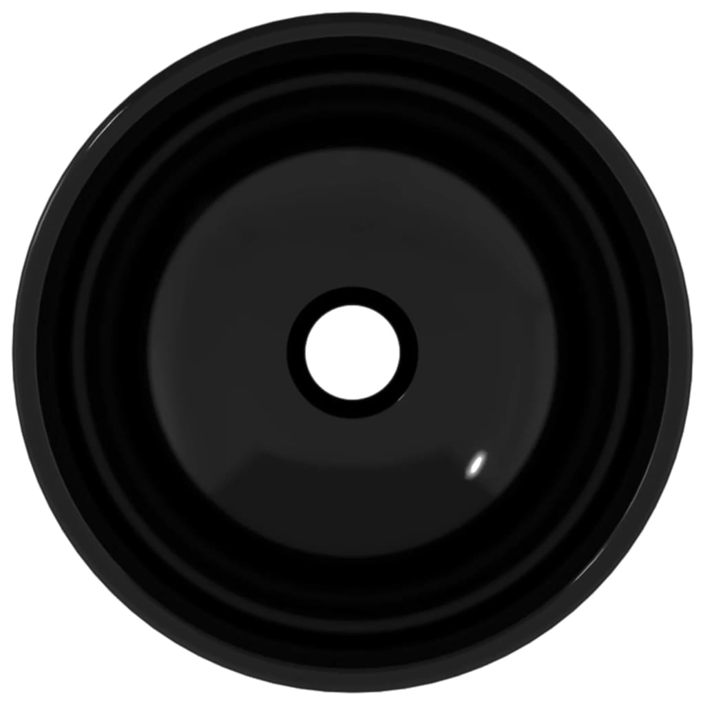 Round black glass basin measuring 50x37x14 cm with a smooth surface and a central drainage hole, designed for modern bathroom use.