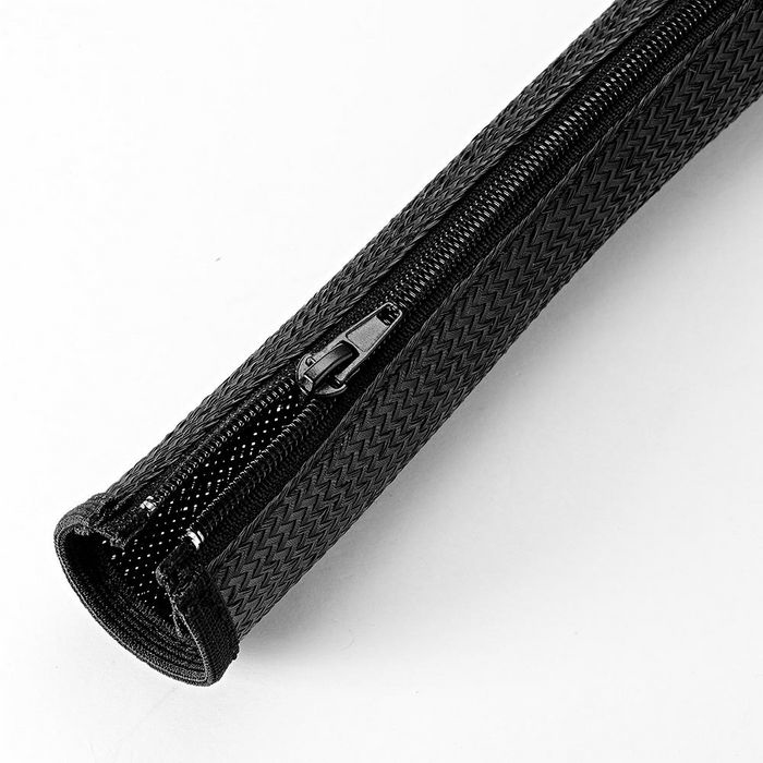 Black cable sleeve made of durable material, featuring a zip closure along one side for easy access and organization of cables.