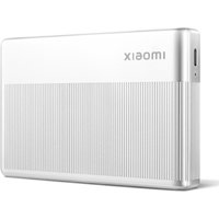 White Xiaomi ZINK photo printer with ribbed texture, compact design, and USB port on the side.