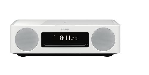 White Yamaha MusicCast 200 speaker with a sleek design, featuring two round speakers on either side, a digital clock display, and a CD player slot in the center.