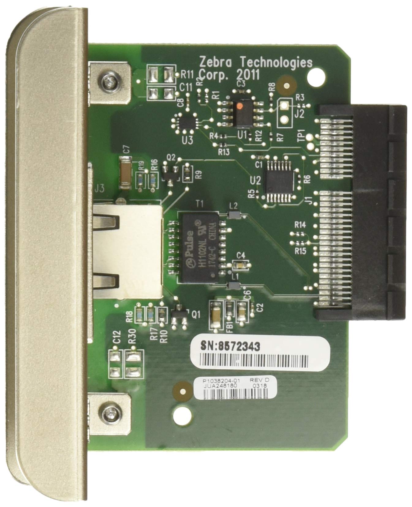 Green circuit board with metal connector, featuring various electronic components, labeled with "Zebra Technologies" and a serial number sticker.