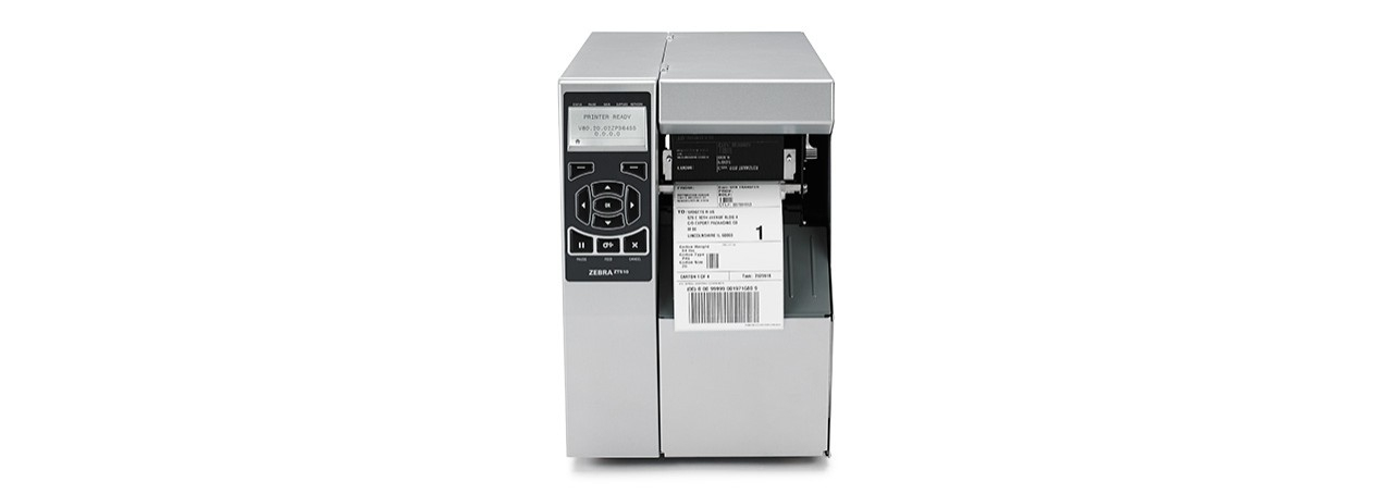 Silver Zebra ZT510 label printer with a front-loading design, featuring a control panel with buttons, and a visible label roll inside, capable of thermal transfer printing.