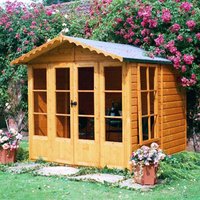 Black plastic grid shed base kit with interlocking panels and drainage holes, designed for a 10x7 shed.