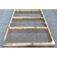 Wooden QuickJACK adjustable shed base system with metal brackets on a concrete surface.