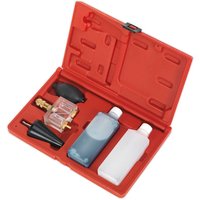 Red Sealey VS0062 Combustion Leak Detector kit with clear chamber, black bulb, and two liquid bottles.
