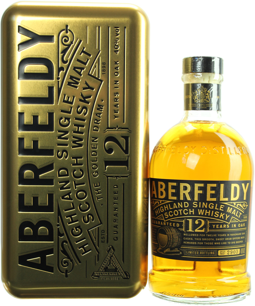 A golden bottle of Aberfeldy 12 Year Old Highland Single Malt Scotch Whisky beside a matching gold tin, both featuring bold black text and a vintage logo.