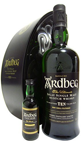 Green glass bottle of Ardbeg 10 Year Old whisky, with a black gift box featuring gold lettering, alongside a smaller 5 cl bottle, both showcasing elegant design and branding.