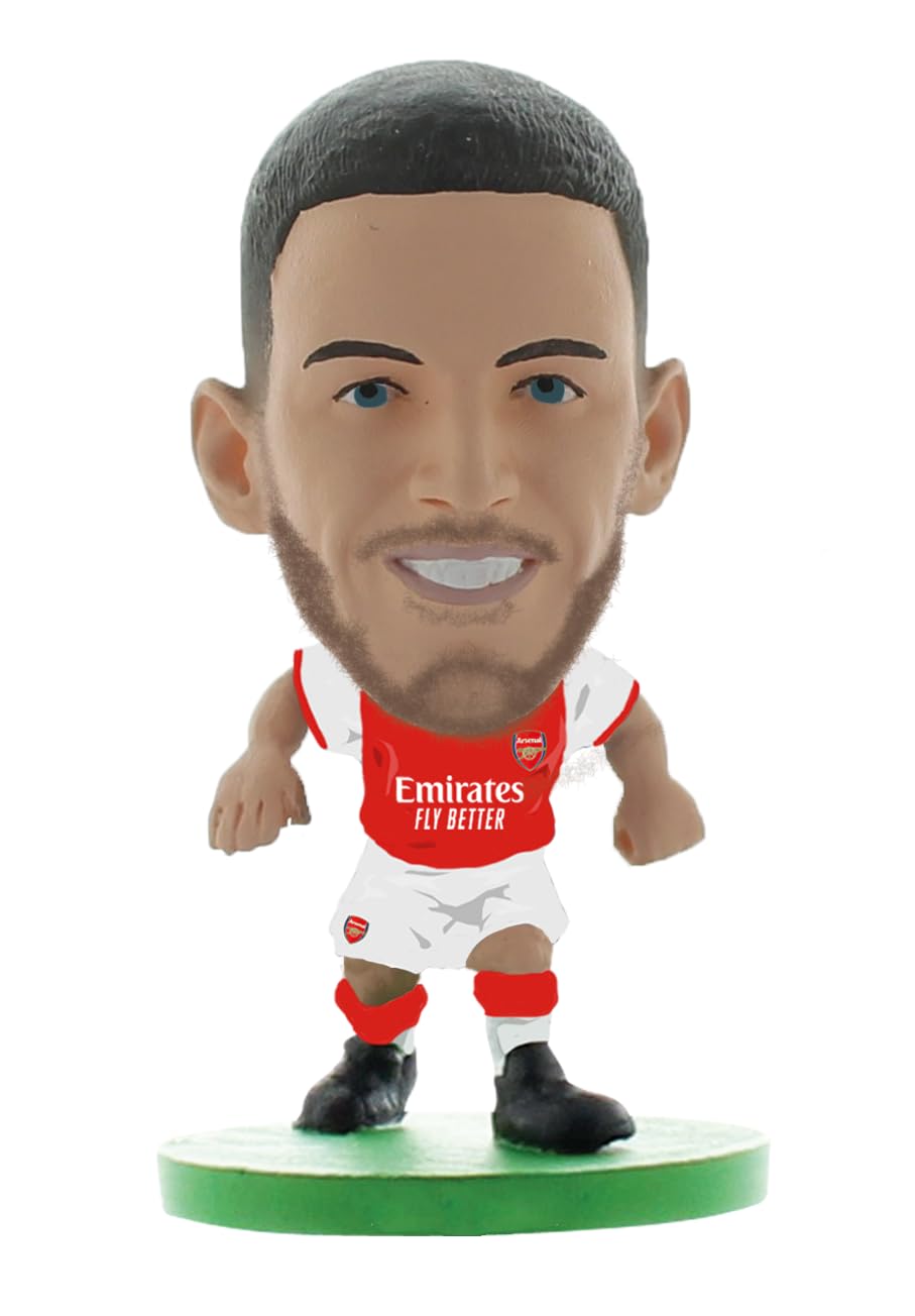 Arsenal Declan Rice figurine in a classic red and white home kit, featuring the Emirates logo, with a smiling face and detailed hair, standing on a green base.
