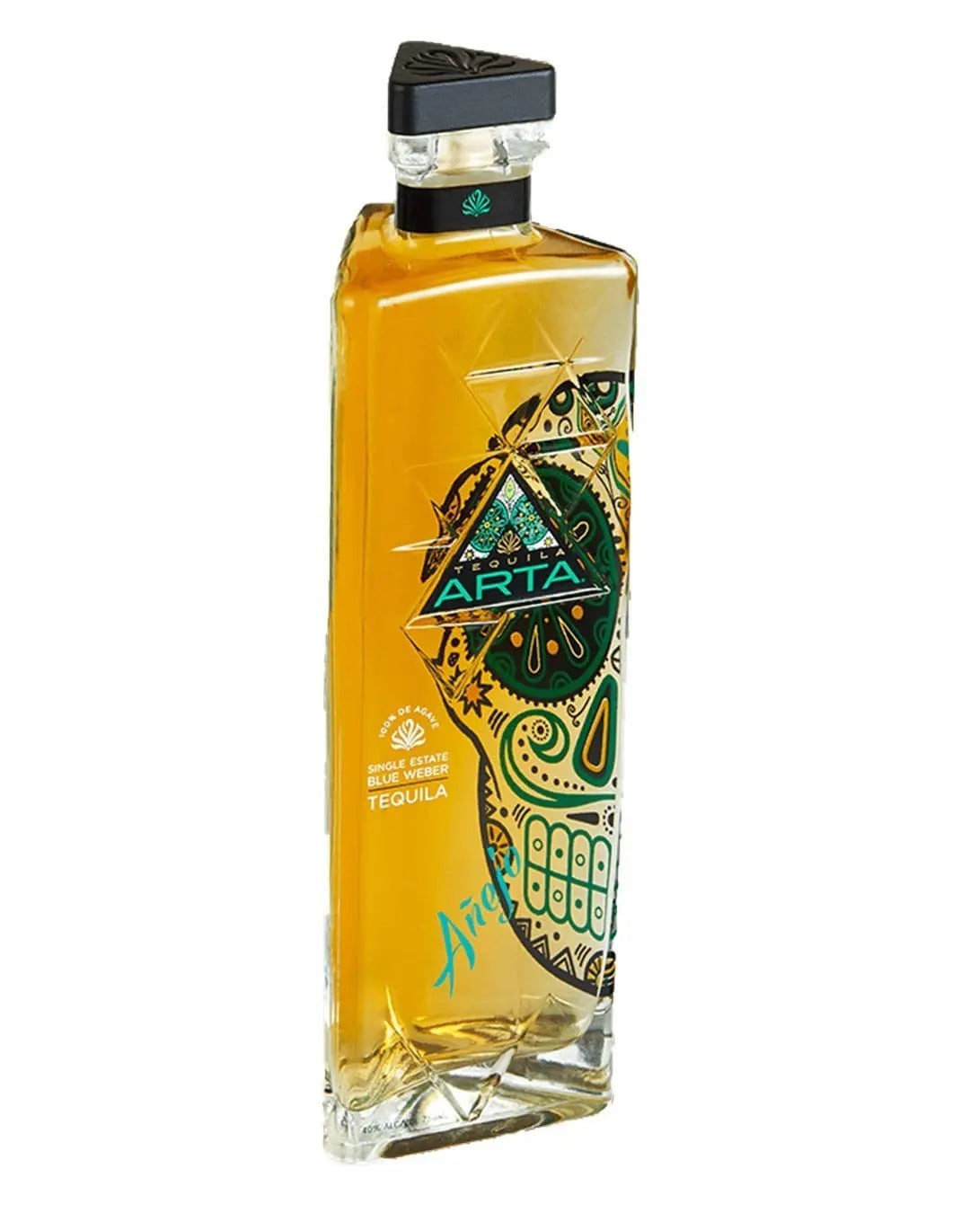Clear glass bottle with a tall, angular shape, featuring a vibrant yellow tequila, decorated with a colorful skull design and the label "ARTA Añejo" in turquoise.