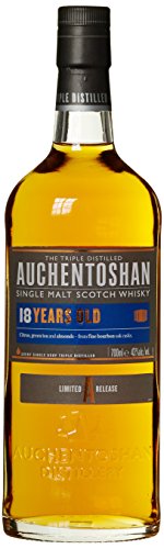 Amber-colored bottle of Auchentoshan 18 Year Old Lowland Single Malt Scotch Whisky, featuring a blue and orange label with text indicating age and distillation details.