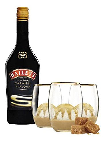 Baileys Caramel Irish Cream Liqueur bottle with a black label and gold accents, accompanied by three clear glasses filled with ice cream and caramel pieces.