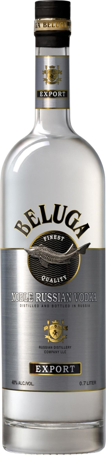 Clear glass bottle of Beluga Noble Russian Plain Vodka, 70 cl, featuring a silver label with gold accents, embossed logo, and a decorative seal, showcasing a premium quality design.