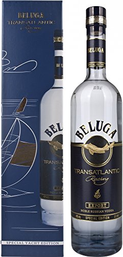 Clear glass bottle of Beluga Transatlantic Vodka, 70 Cl, featuring a gold and blue label with the Beluga logo, alongside a decorative blue box with a yacht design.