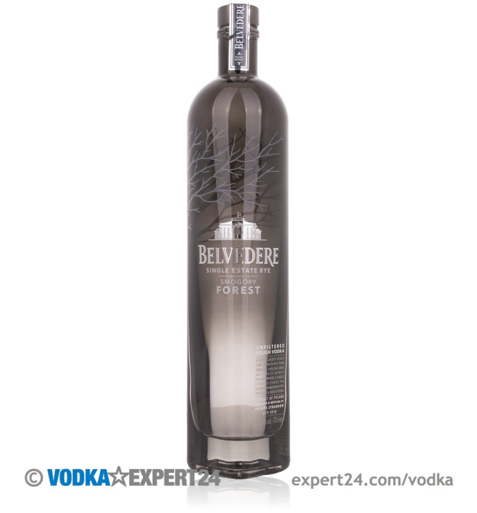 Clear glass bottle with a sleek design, featuring a dark gray label with white tree silhouettes and "Belvedere Single Estate, Smogory Forest" text, holding 70 cl of vodka.