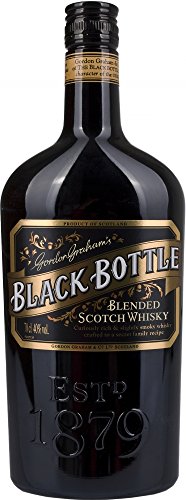 A tall, dark glass bottle of Black Bottle Blended Scotch Whisky, featuring a gold label with elegant text and the year "1879" prominently displayed.
