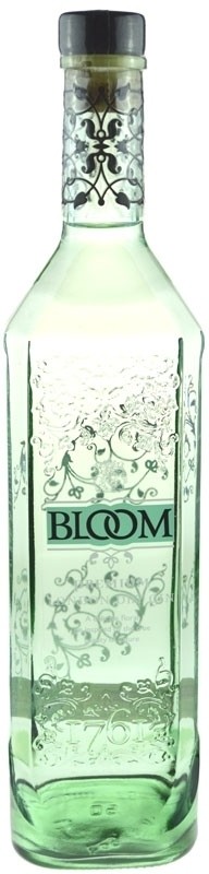 Clear glass bottle of Bloom Gin, 70 Cl, featuring an elegant floral design and the word "BLOOM" in teal, with a black cap and intricate silver detailing.