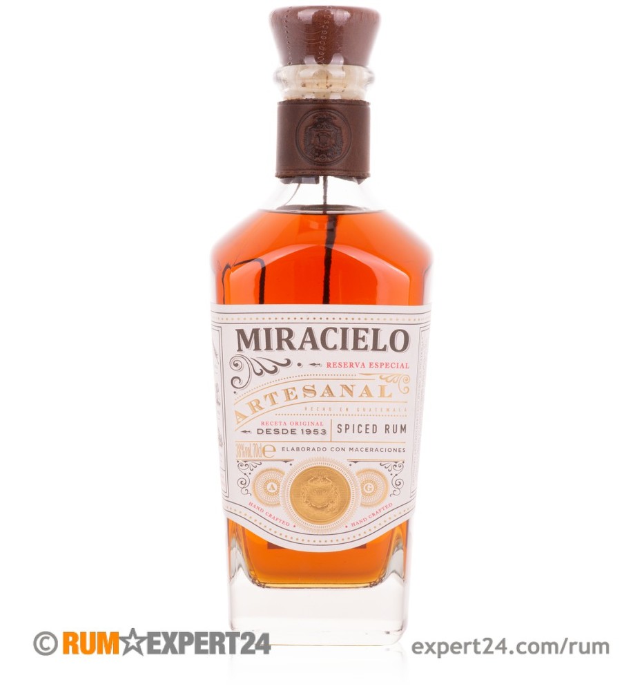 Botran Miracielo Rum bottle features a tall, elegant glass design with a wooden cork, showcasing a rich amber liquid and ornate label detailing in gold and white.