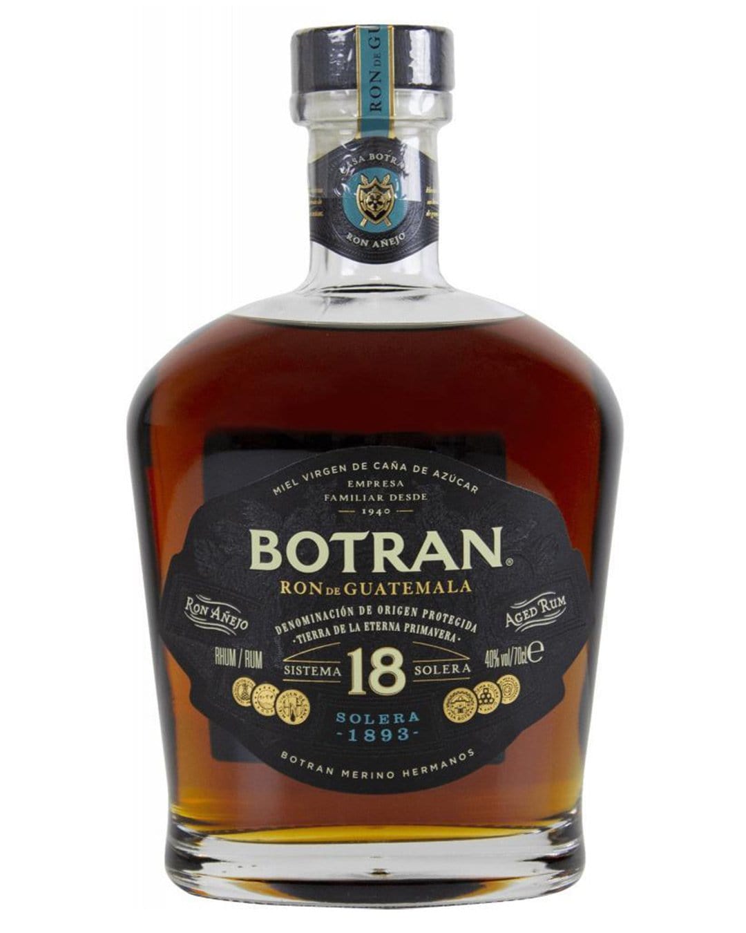 Botran Solera 18 Year Old Gran Reserva Rum in a clear, rounded glass bottle with a black and gold label, featuring a silver cap and a rich amber liquid.