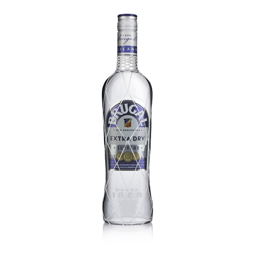 Clear glass bottle of Brugal Blanco Especial Rum, featuring a diamond-patterned design, blue and silver label, and a silver screw cap, holding 70 cl of rum.