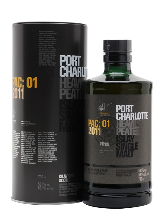 Green glass bottle of Bruichladdich Port Charlotte PAC: 01 2011 Whisky, featuring a black and white label, with a cylindrical black tin packaging beside it, both displaying detailed text.