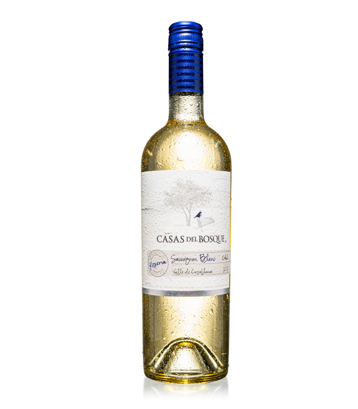 Clear glass bottle of Casas Del Bosque Reserva Sauvignon Blanc, featuring a blue screw cap, a textured label with white and blue accents, and droplets of water on the surface.