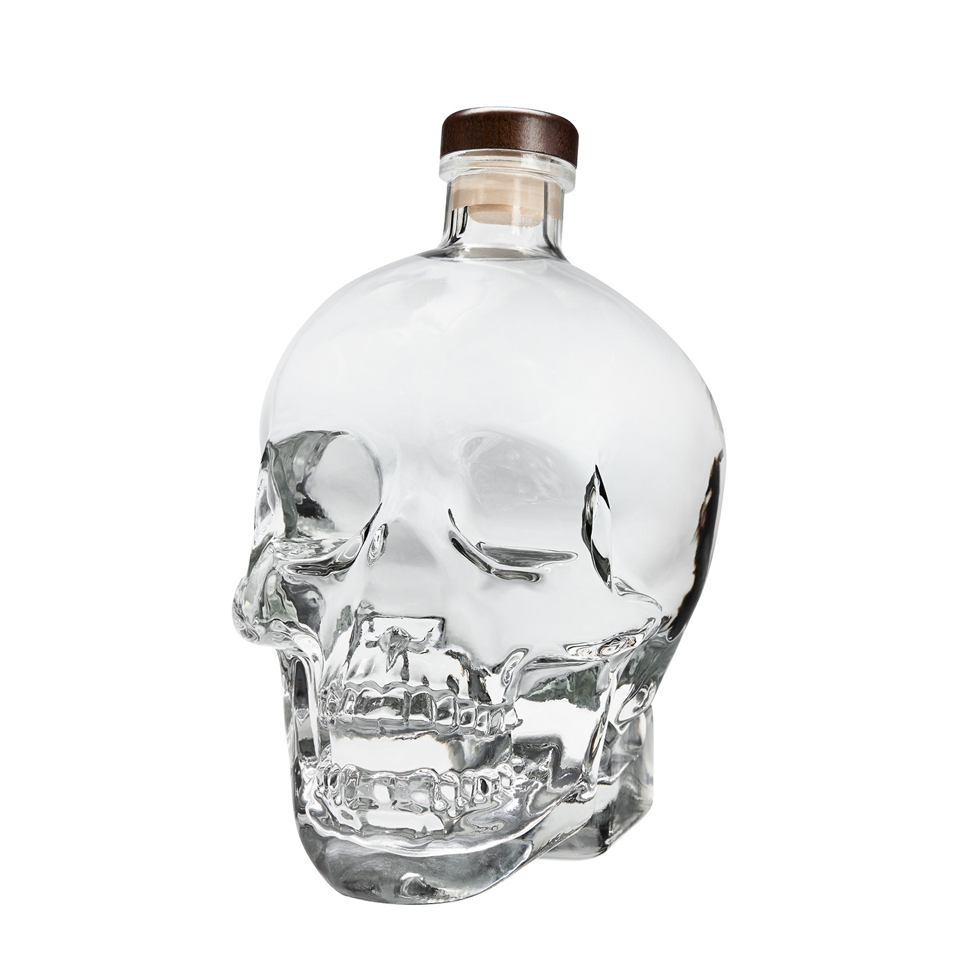 Clear glass skull-shaped vodka bottle with a wooden cork, showcasing intricate details of the skull design, containing 1.75 liters of Crystal Head Vodka.