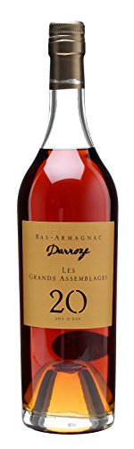 A clear glass bottle of Darroze Les Grands Assemblages 20 Year Old Armagnac, featuring a rich amber liquid, a gold label with black text, and a metallic cork closure.