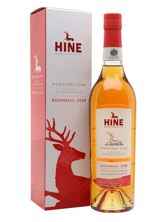 Clear glass bottle of Domaines Hine Bonneuil 2008 Cognac, featuring a golden amber liquid, with a red and white box displaying a deer logo and vintage details.
