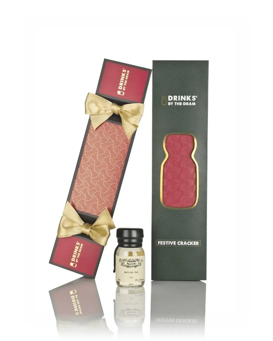 Red festive cracker with gold bow, featuring a green box design labeled "Drinks by the Dram," containing a small bottle of Bathtub Gin.