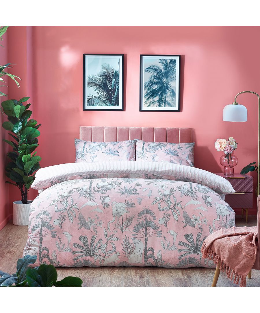 Reversible king duvet cover set featuring a pink tropical palm print on one side and a striped pattern on the other, made of soft cotton, complemented by matching pillow shams.