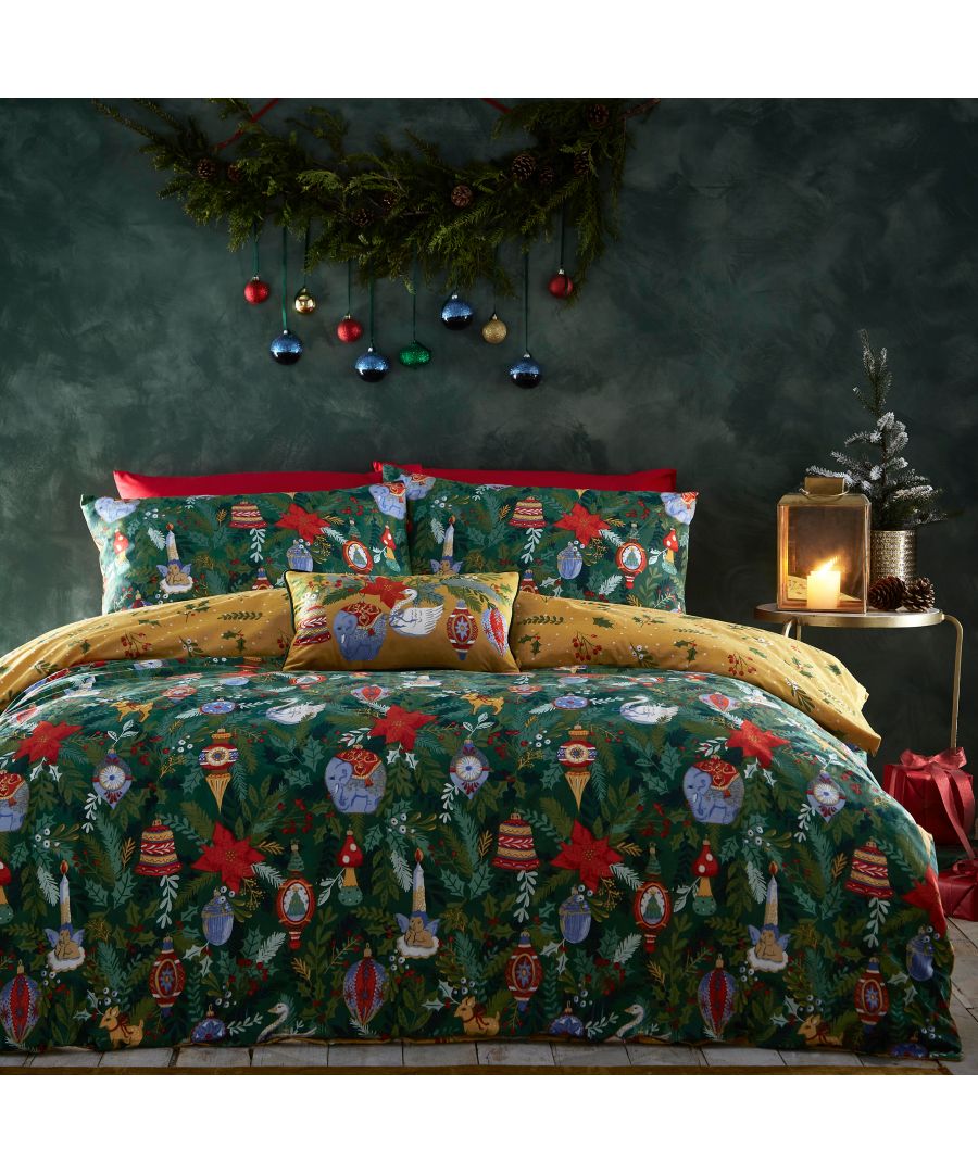 Dark green reversible duvet cover set featuring festive Christmas designs with ornaments, holly, and candles, complemented by red and yellow accents, suitable for a super king bed.