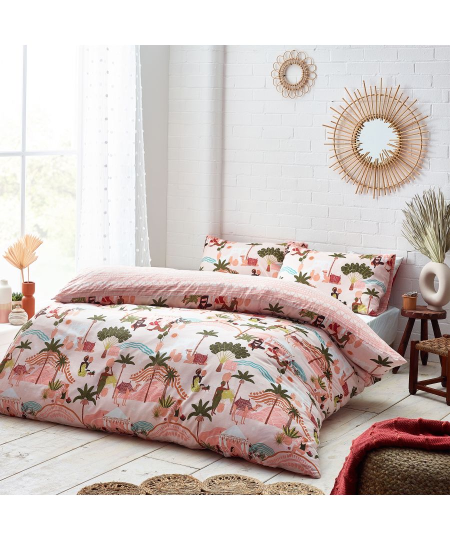 Reversible king duvet cover set in sand cotton featuring a colorful tropical print with animals and palm trees, complemented by matching pillowcases and a textured backdrop.