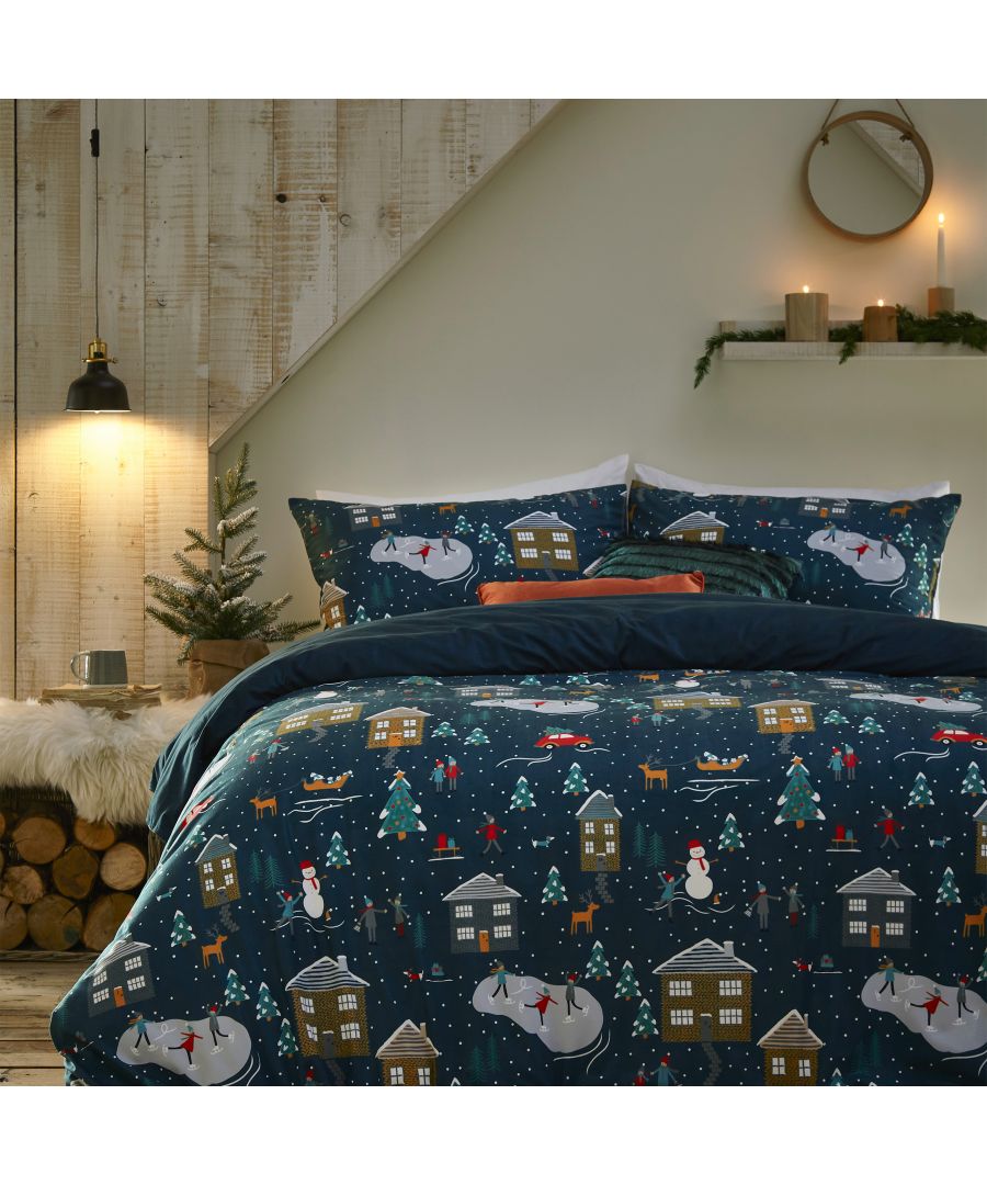 Navy fleece duvet cover set featuring festive winter pines, snowmen, and cozy cabins, complemented by matching pillowcases, ideal for a double bed.