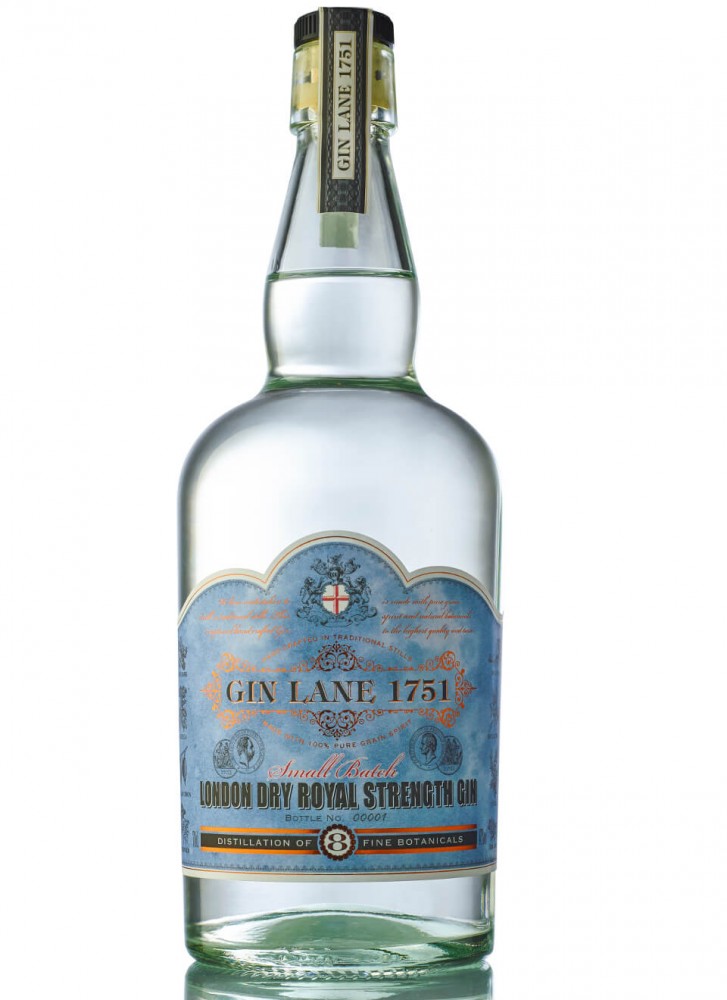 Clear glass bottle of Gin Lane 1751 Royal Strength Gin, featuring a blue and gold label with intricate designs, stating "London Dry Royal Strength Gin" and a 70 Cl capacity.