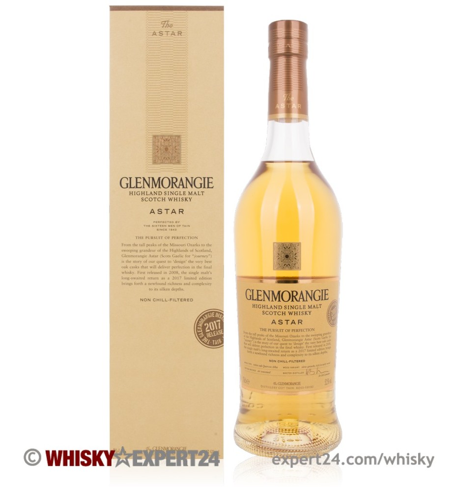 Clear glass bottle of Glenmorangie Astar Whisky, 70 Cl, featuring a light golden liquid, with a tall neck and a textured label, accompanied by a beige box with gold accents.