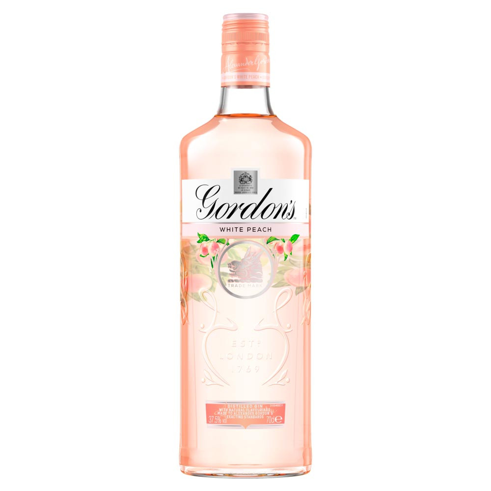Clear glass bottle of Gordon's White Peach Distilled Gin, featuring a light pink liquid, floral accents, and a white label with gold lettering, 70 cl size.