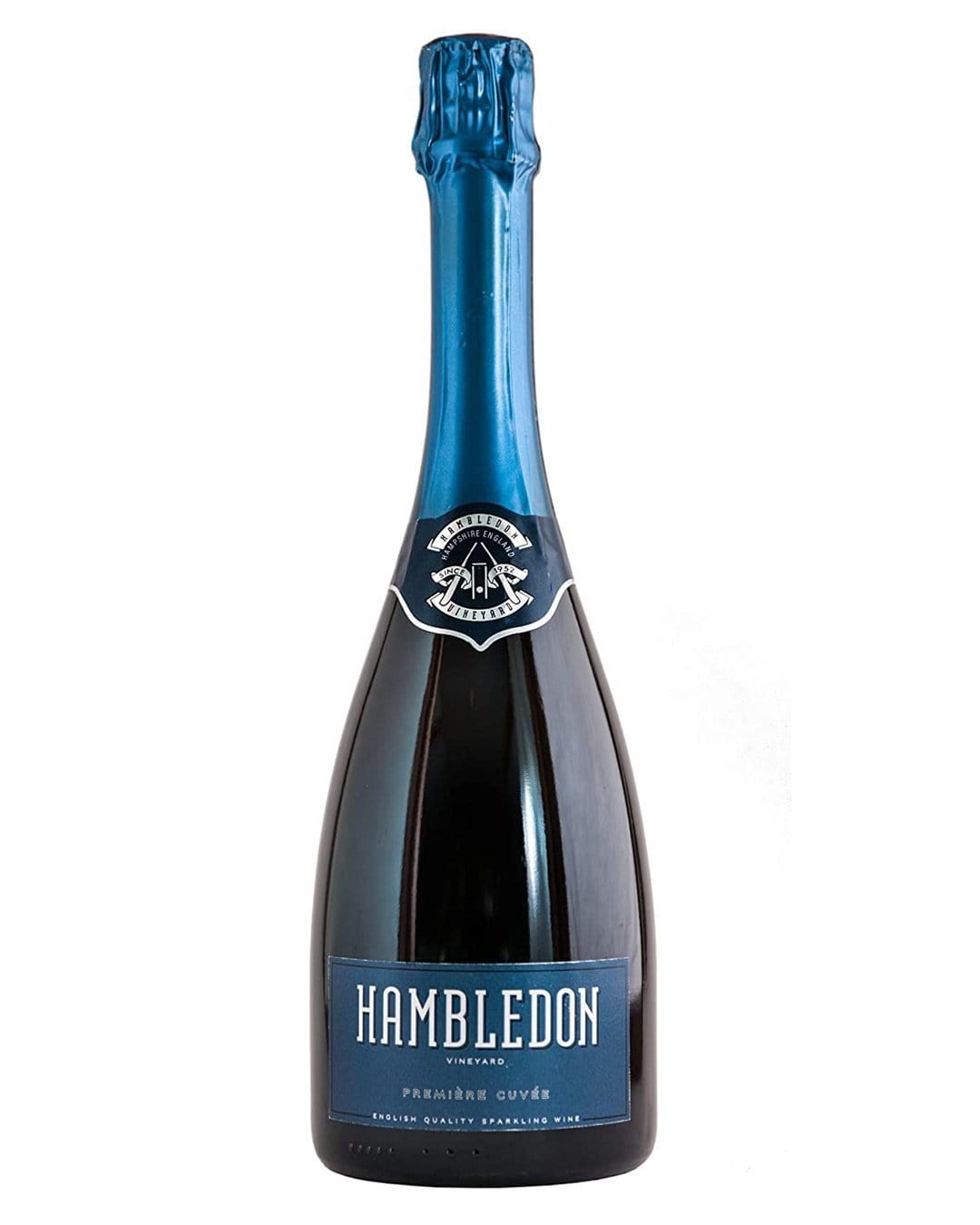 A dark glass bottle of Hambledon Premiere Cuvee English Sparkling Wine with a blue foil cap, featuring a silver logo and a blue label with white text.