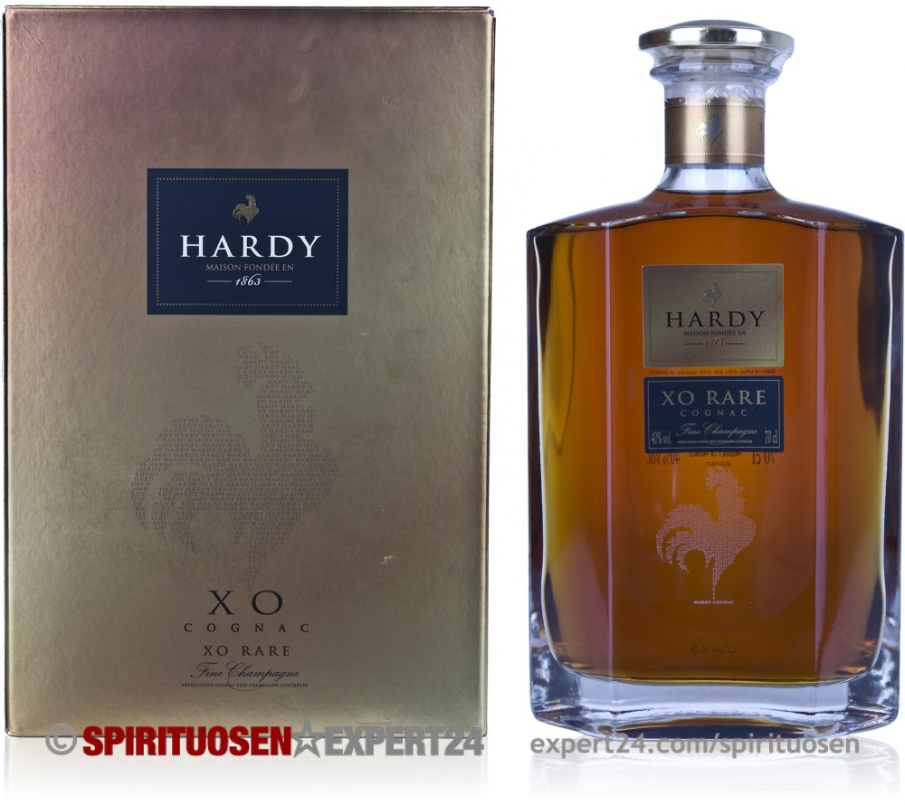 Elegant glass bottle of Hardy XO Rare Cognac with a square shape, featuring a crystal stopper, set against a gold box with a logo and rooster emblem.